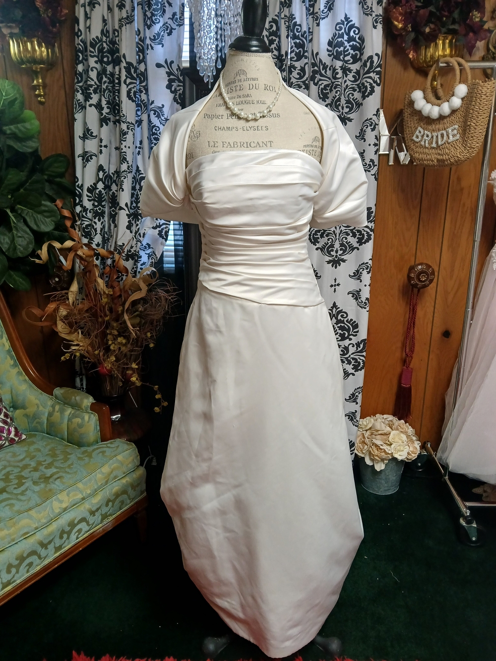 Mon Cheri Ivory Satin A‑Line Wedding Dress with Ruched Bodice